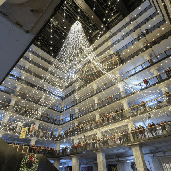 holiday lights strung in the atrium of Crosstown Concourse