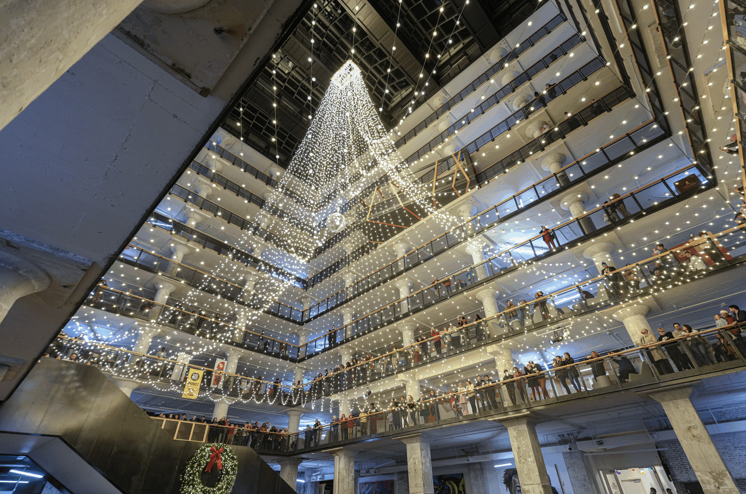 holiday lights strung in the atrium of Crosstown Concourse