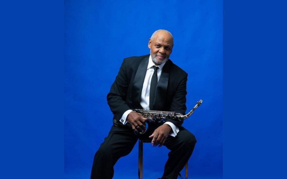 Man holding a saxophone