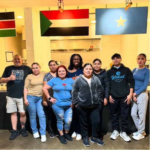 group of people standing in Global Café
